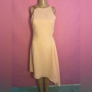 Halston Heritage pink dress with side cutout with gold accents on shoulder